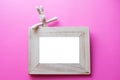 Kids Frame for photos with children toy on pink background. birthday frame