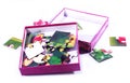 Kids funny puzzle pieces in the paper box