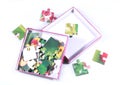 Kids funny puzzle pieces in the paper box Royalty Free Stock Photo