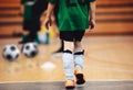 Kids futsal training. Indoor soccer players training with balls. Royalty Free Stock Photo