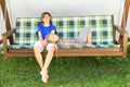 Kids on a garden swing Royalty Free Stock Photo