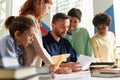 Kids Gathered at Desk of Teacher