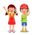 Kids girl and boy talking on a mobile smart phones Royalty Free Stock Photo