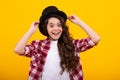 Kids girl in old fashion clothes. Elegent hat, cylinder hat isolated on yellow background. Headwear. Clothes accessories