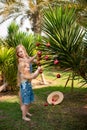Kids girls dress up palm tree with Christmas toys