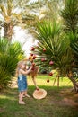 Kids girls dress up palm tree with Christmas toys