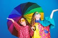 Kids girls happy friends under umbrella. Bright umbrella. Happy childhood. It is easier to be happy together. Be rainbow