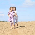 Kids - girls running on field Royalty Free Stock Photo