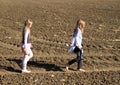 Kids - girls walking on field Royalty Free Stock Photo