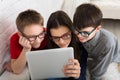 Kids in glasses with tablet, computer addiction