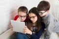 Kids in glasses with tablet, computer addiction