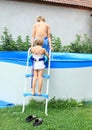 Kids going into pool Royalty Free Stock Photo