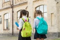 Kids going to school schoolgirls with backpacks, september concept