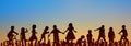 Kids, group of children playing with sunset sky background - people silhouette -