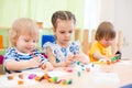 Kids group doing arts and crafts in day care centre Royalty Free Stock Photo