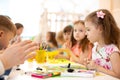 Kids group learning arts and crafts in daycare centre Royalty Free Stock Photo