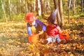 Kids in halloween costume play at autumn park, trick or treating