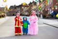 Kids on Halloween trick or treat.