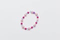 Kids handmade beaded jewelry. Necklaces and bracelets made from multicolored beads and pearls. DIY bracelet beads