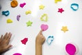 Kids hands with colorful clays on white table Royalty Free Stock Photo