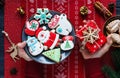 Kids hands with gift on red background. Holidays and celebration concept, greeting card mockup, festive decoration. Christmas