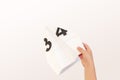 Kids hands holding origami paper airplane with numbers. Mathematics learning concept Royalty Free Stock Photo