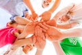 Kids hands together in circle laying one on another Royalty Free Stock Photo