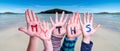 Kids Hands Holding Word Myths, Ocean Background