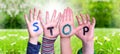 Kids Hands Holding Word Stop, Grass Meadow