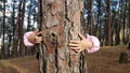 Kids hands hugging tree trunk Royalty Free Stock Photo