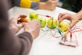 Kids hands with invention kit at robotics school