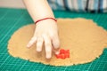 Kids hands making dough cookies