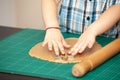 Kids hands making dough cookies