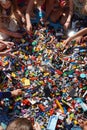 Kids hands reaching for lego blocks