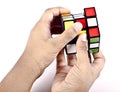 Kids hands solving rubiks cube Royalty Free Stock Photo