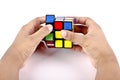 Kids hands solving rubiks cube Royalty Free Stock Photo
