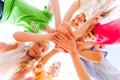 Kids hands together in circle laying one on another Royalty Free Stock Photo