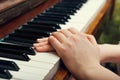 Kids hands on a white old piano keys Royalty Free Stock Photo