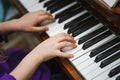 Kids hands on a white piano key Royalty Free Stock Photo