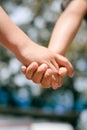 Kids handshake closeup on sunny outdoors background Royalty Free Stock Photo