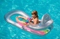 Kids happy summer. Summertime vacation. Child in pool. Boy swimming at swimmingpool. Funny kid on inflatable rubber