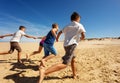 Kids have fun running on the sand beach together Royalty Free Stock Photo