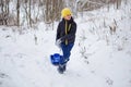 Kids have fun sledding with snow slides Royalty Free Stock Photo