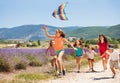 Kids having fun flying colorful kite in summer Royalty Free Stock Photo