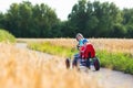 Kids having fun with a go cart car Royalty Free Stock Photo