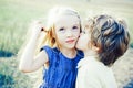 Kids having fun in green field against blue sky background. Festive Art Greeting Card. Lovely children. Little angels in