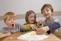 Kids having fun making dough