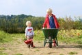 Kids having fun on pumpkin field Royalty Free Stock Photo