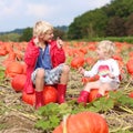 Kids having fun on pumpkin field Royalty Free Stock Photo