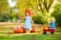 Kids having fun at pumpkin patch Royalty Free Stock Photo